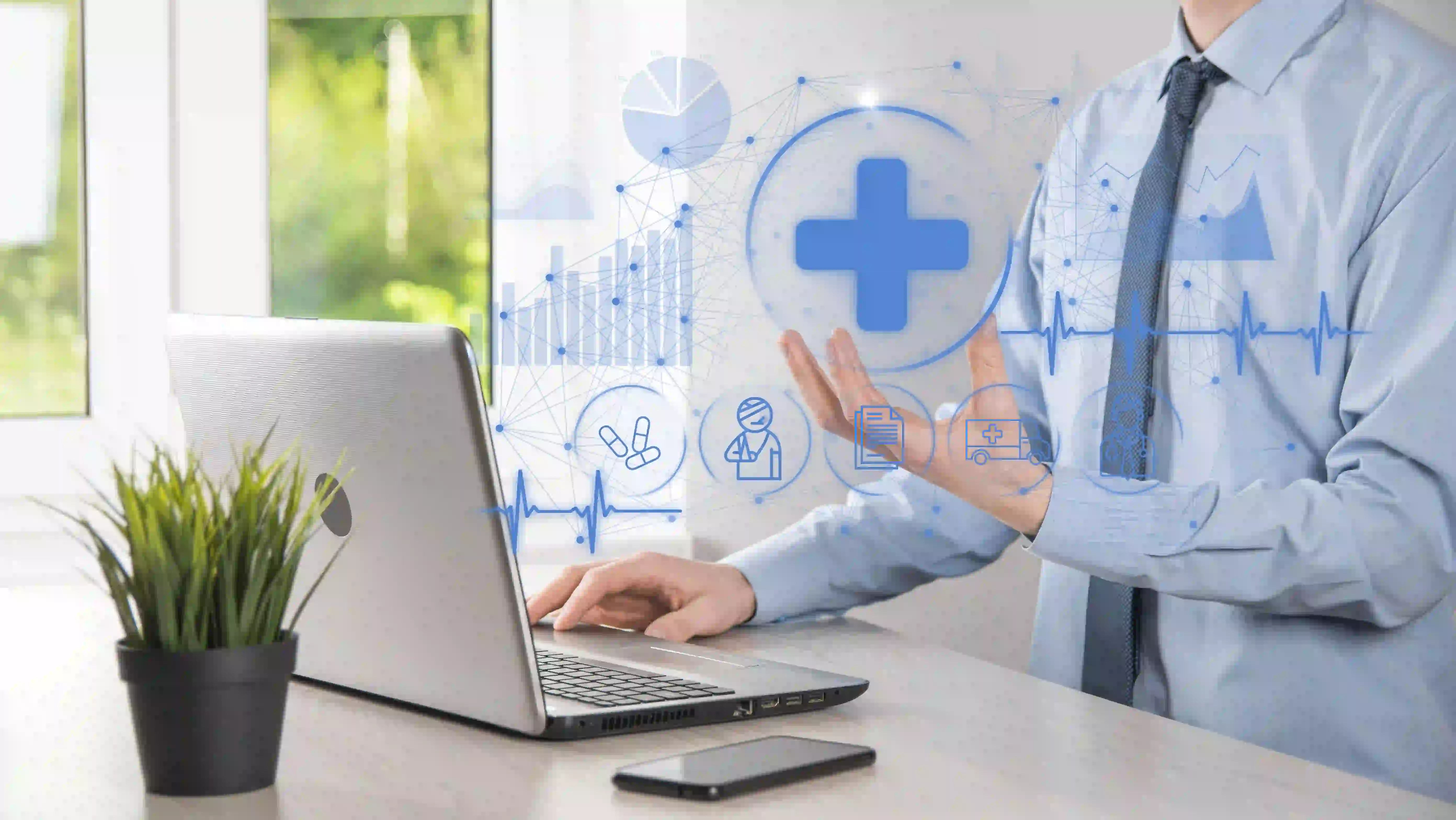 Health system administrator reviewing unified electronic health records across multiple hospital facilities